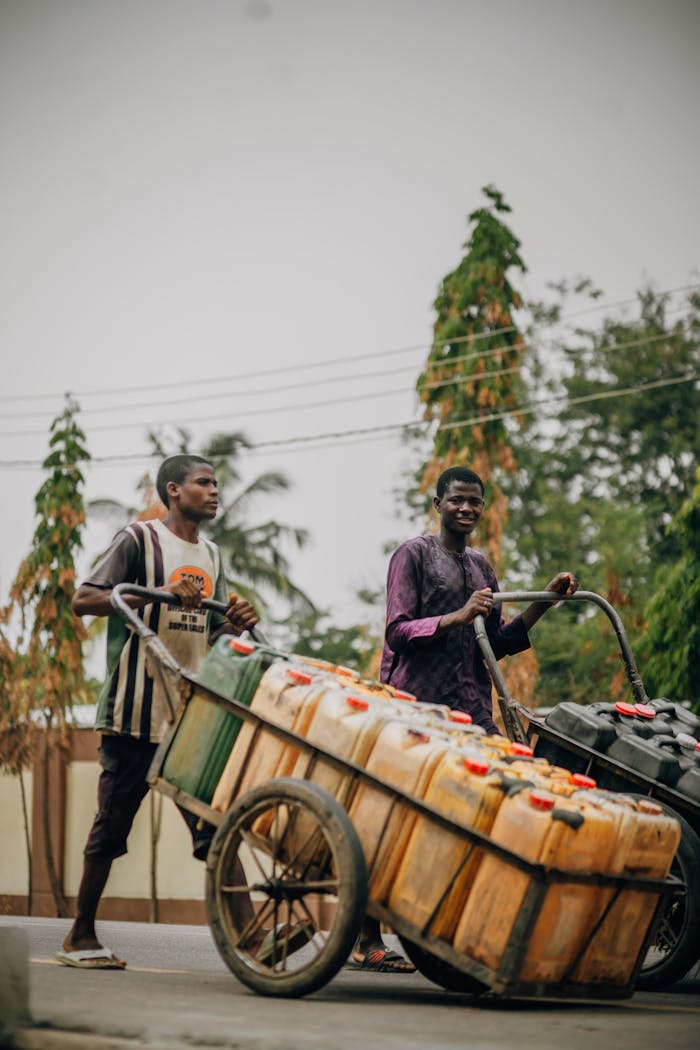 street-vendors-transporting-goods-in-urban-area-32299065